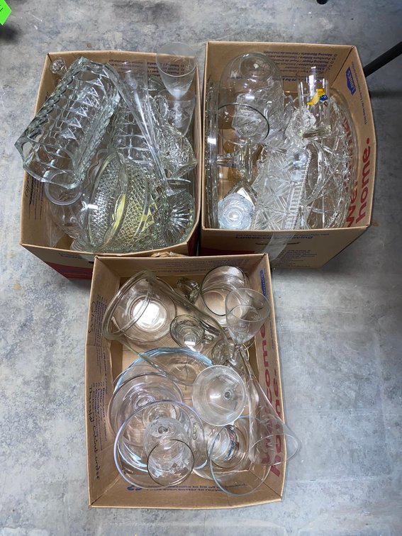 Clear glass pitchers, serving glasses and stemware