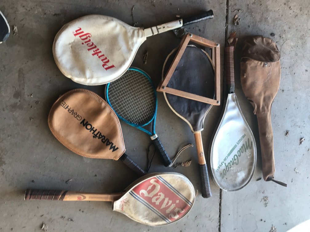 Assortment of tennis and racket ball rackets