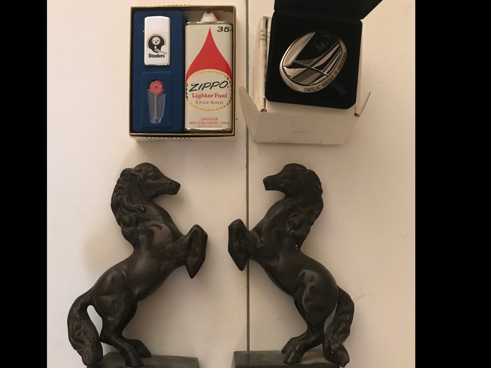 Book ends, Steelers Zippo lighter, Cadillac emblem