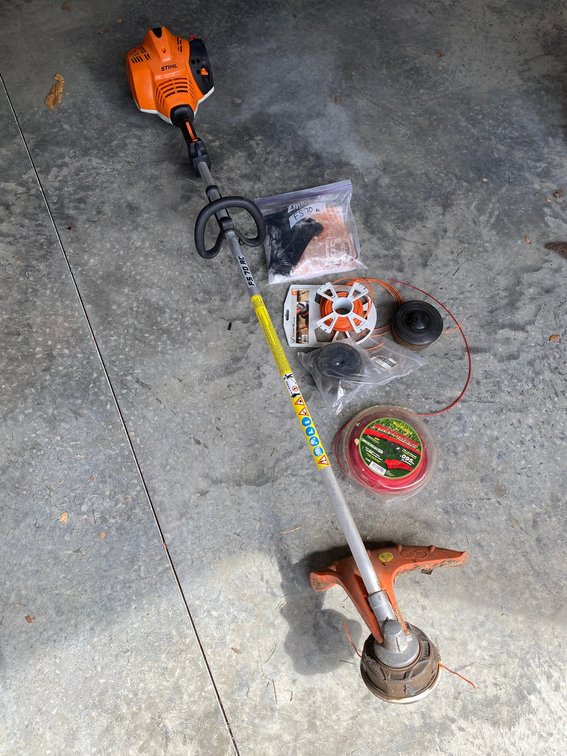 Stihl model FS70RC straight shaft gasoline string trimmer with extra string and shoulder strap