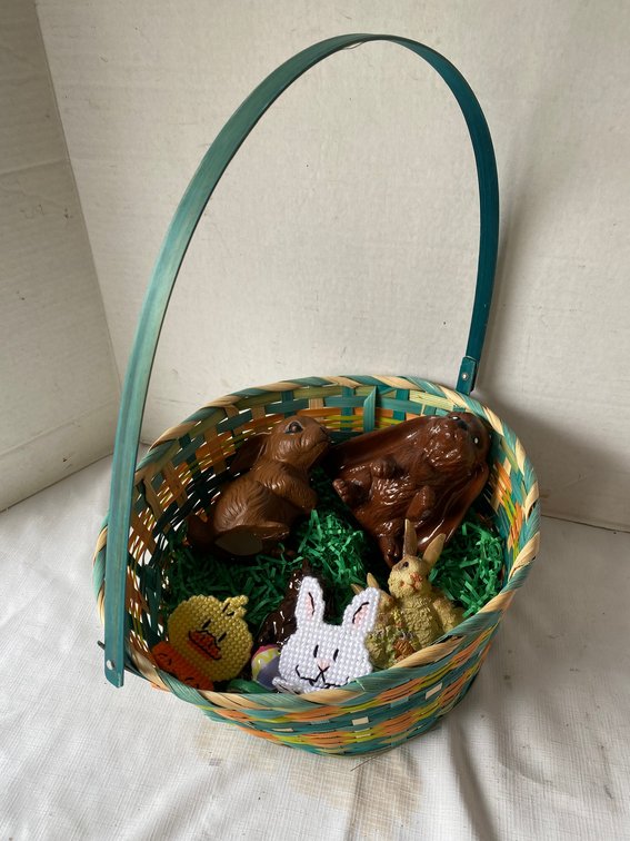 Easter basket filled with ceramic Easter Bunny decorations