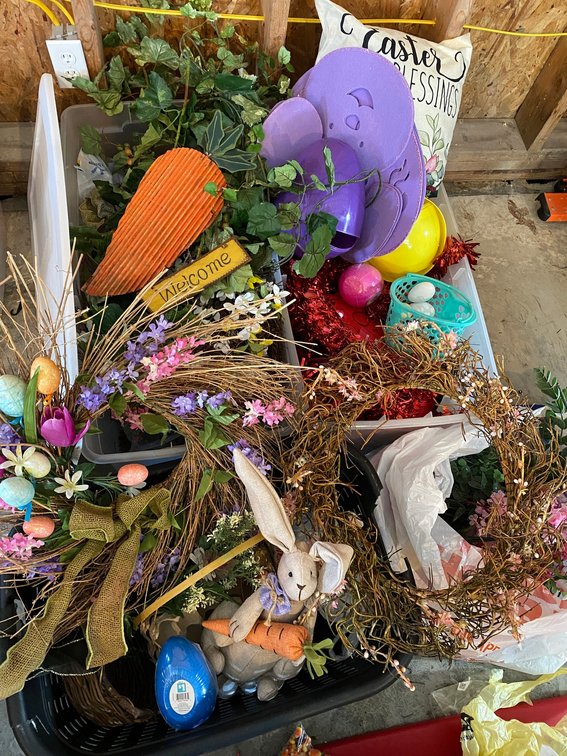 2 Totes and laundry basket filled with spring and Easter decorations