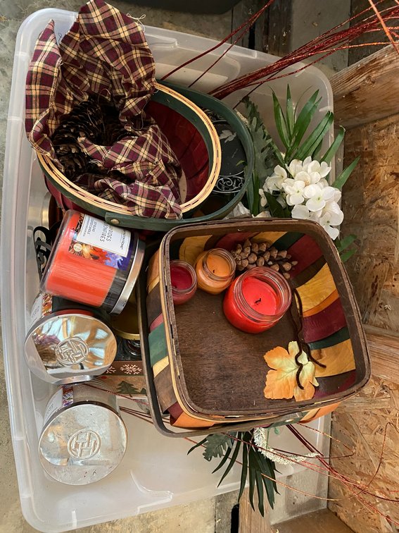 Tote full of decorative items, several newish candles