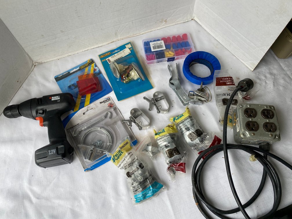 Black & Decker 7.2 Volt drill, extension cord, cable tighteners, wire, nuts, galvanized fence panel clamps