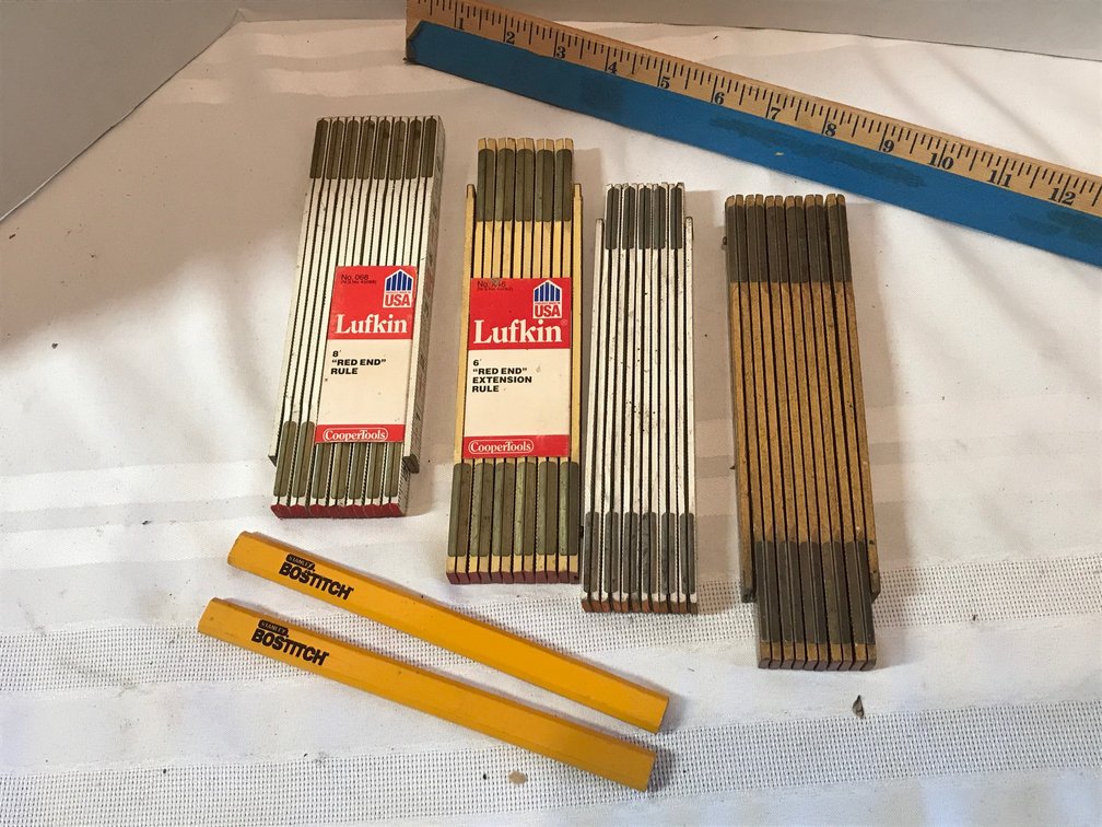 Wooden extension rulers and carpenter pencils