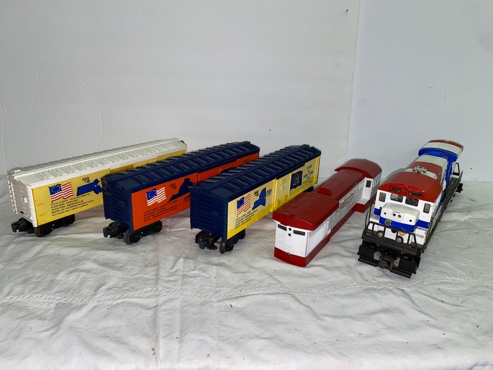 Selection of Lionel Spirit of 76 Rolling Stock, 1-Locomotive with a Spare Shell