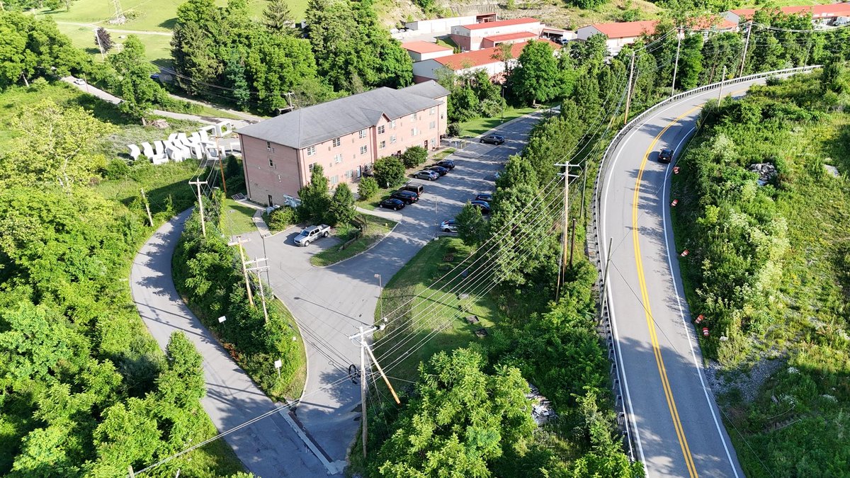Image for SOLD $1,430,000 - Four Story Brick Apartment Building and Quadplex on 3.13 Acres in Morgantown