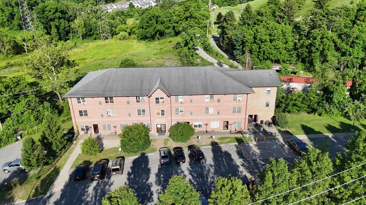 Image for SOLD $1,430,000 - Four Story Brick Apartment Building and Quadplex on 3.13 Acres in Morgantown