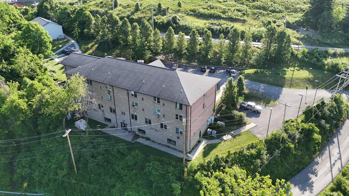 Image for SOLD $1,430,000 - Four Story Brick Apartment Building and Quadplex on 3.13 Acres in Morgantown