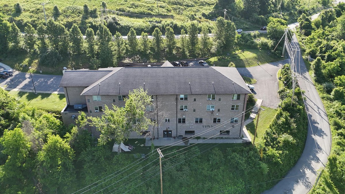 Image for SOLD $1,430,000 - Four Story Brick Apartment Building and Quadplex on 3.13 Acres in Morgantown