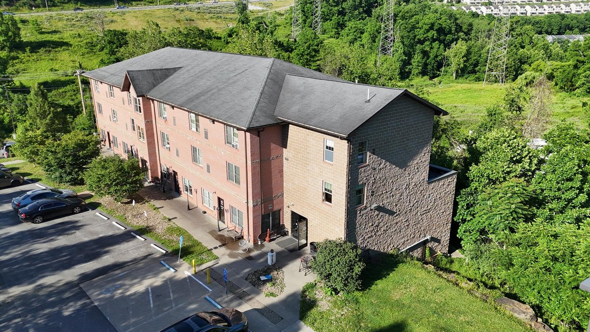 Image for SOLD $1,430,000 - Four Story Brick Apartment Building and Quadplex on 3.13 Acres in Morgantown