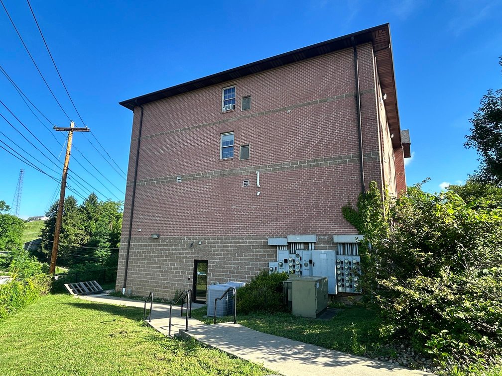 Image for SOLD $1,430,000 - Four Story Brick Apartment Building and Quadplex on 3.13 Acres in Morgantown