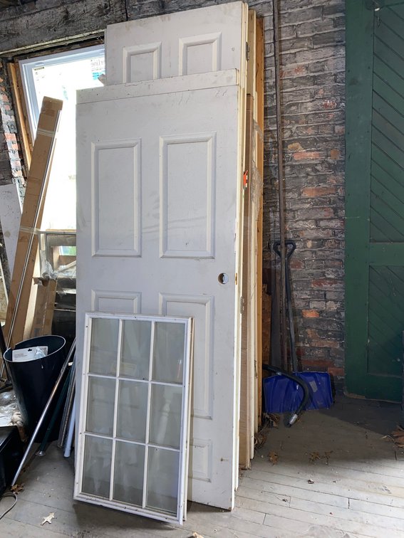Assortment of 11 Doors, 1 is a Prehung Door