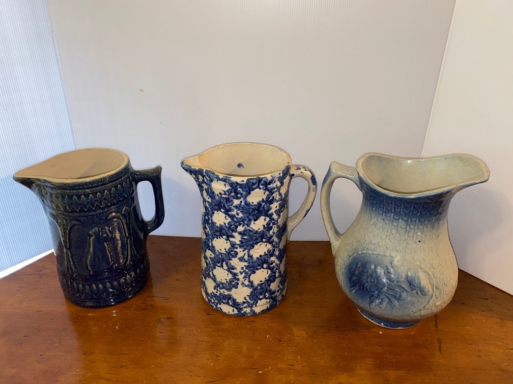 Blue and white stoneware pieces including water pitchers
