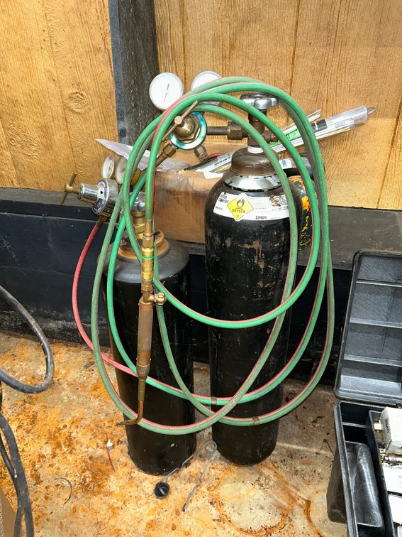 1-Oxygen, 1-Acetylene Tank, Set of Gauges, Braising rods, Torch and Hose
