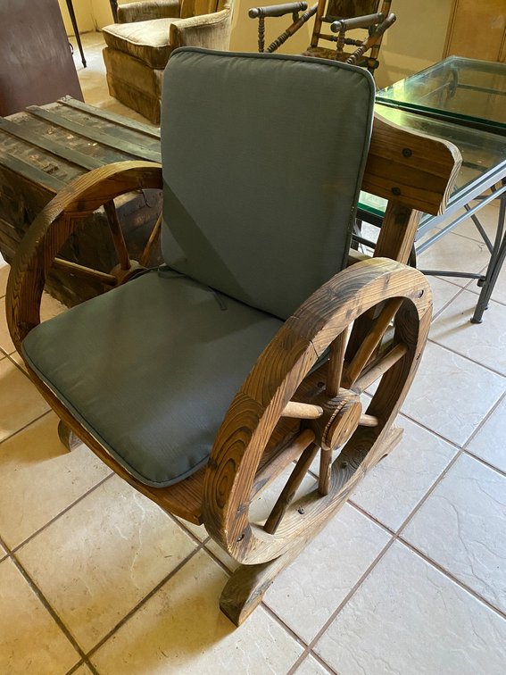 Rustic wooden wagon wheel armchair