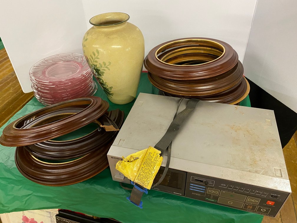 Round Wooden Picture Frames, Set of Pink Plates, Vase, Sony Receiver