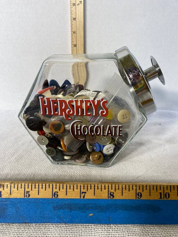 Small glass Cookie Jar Marked Hersheys Chocolate with many Assorted Buttons