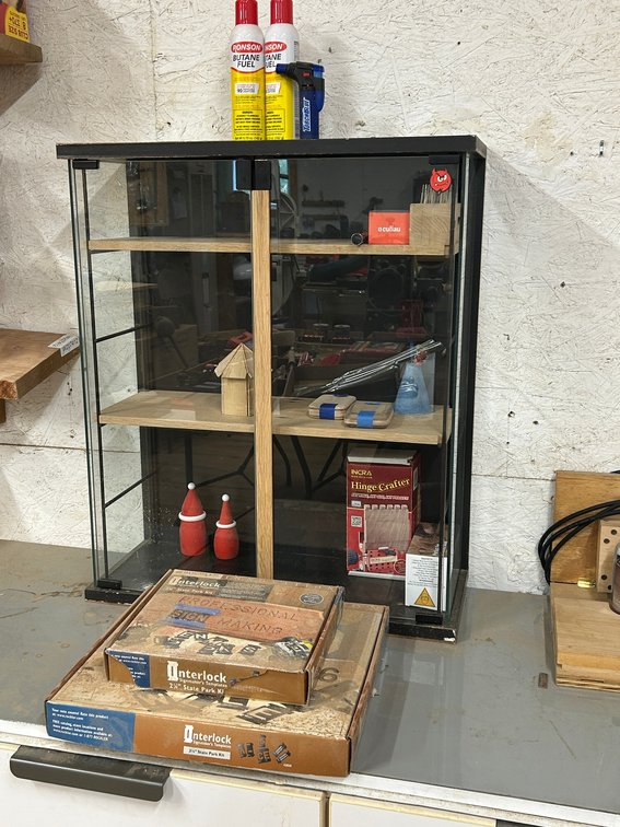 Glass display case with contents