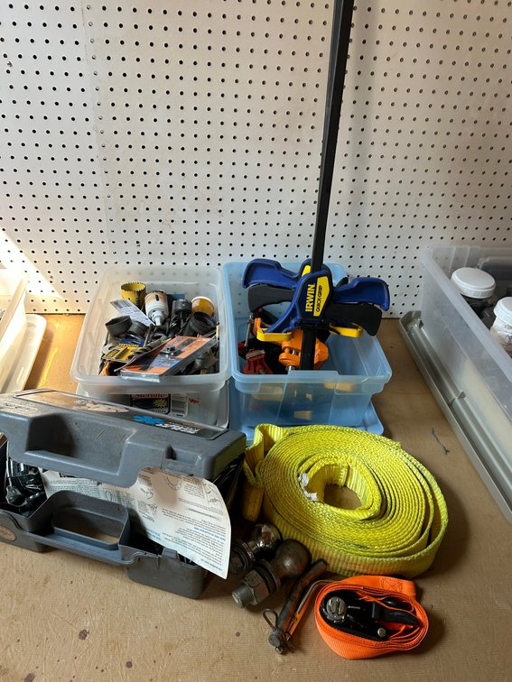 2 Totes with assorted drill bits, hole saws, wood clamps, straps, tire chains