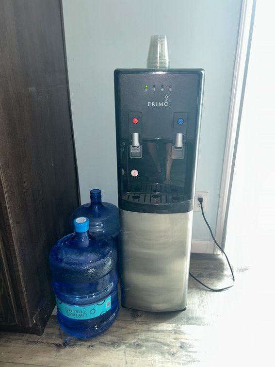 Primo water dispenser with water jugs