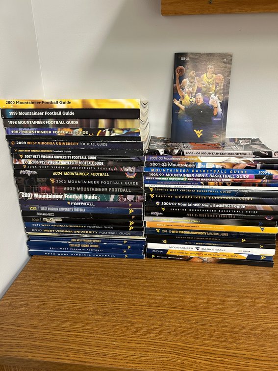 Collection of WVU Mountaineer Football and Basketball guides