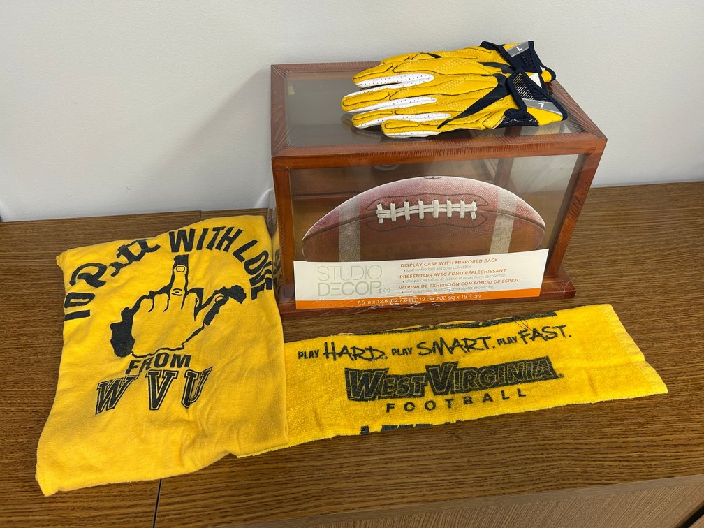 Football display case, vintage WVU memorabilia