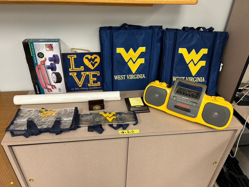 Sony radio, WVU seat cushions, air hockey game, signed Bernhard Langer golf poster