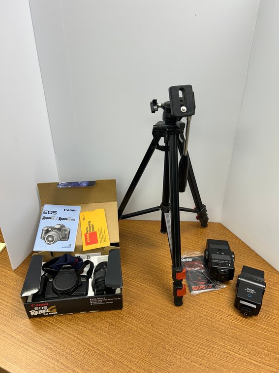 Canon Rebel camera with tripod and accessories