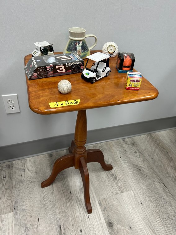 Wooden table with golf memorabilia
