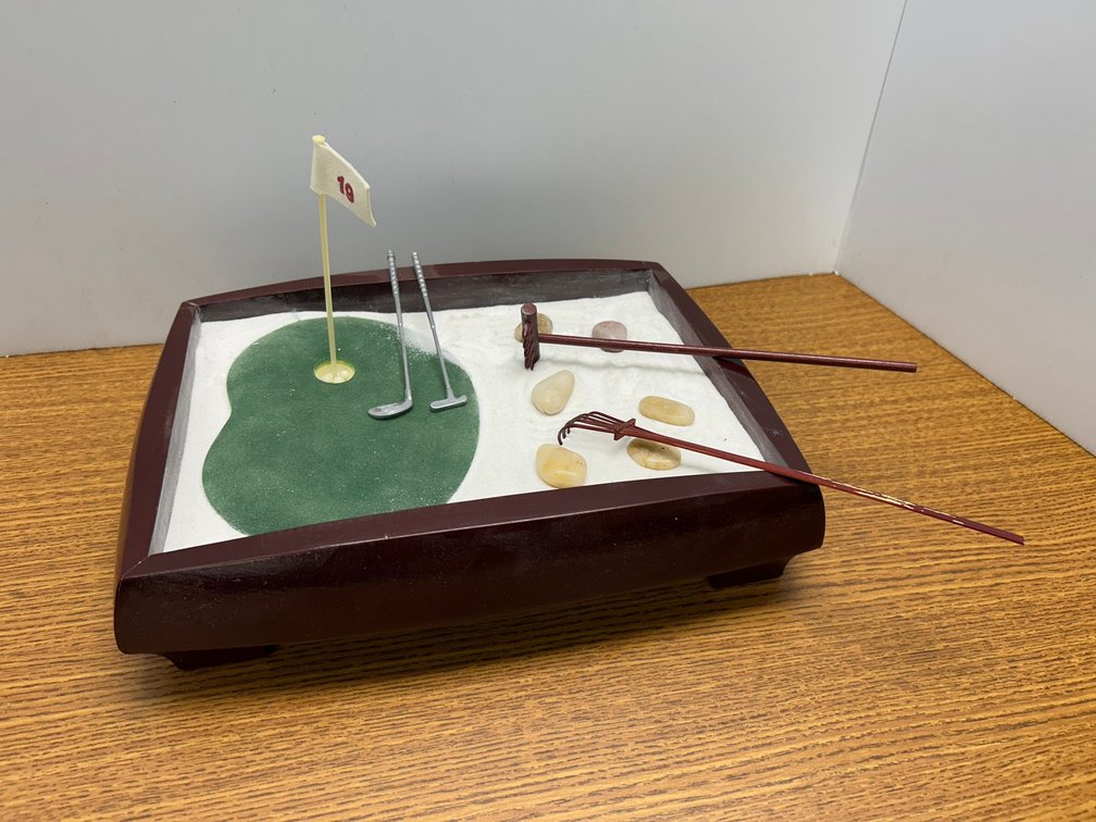 Desktop golf item with sand and green