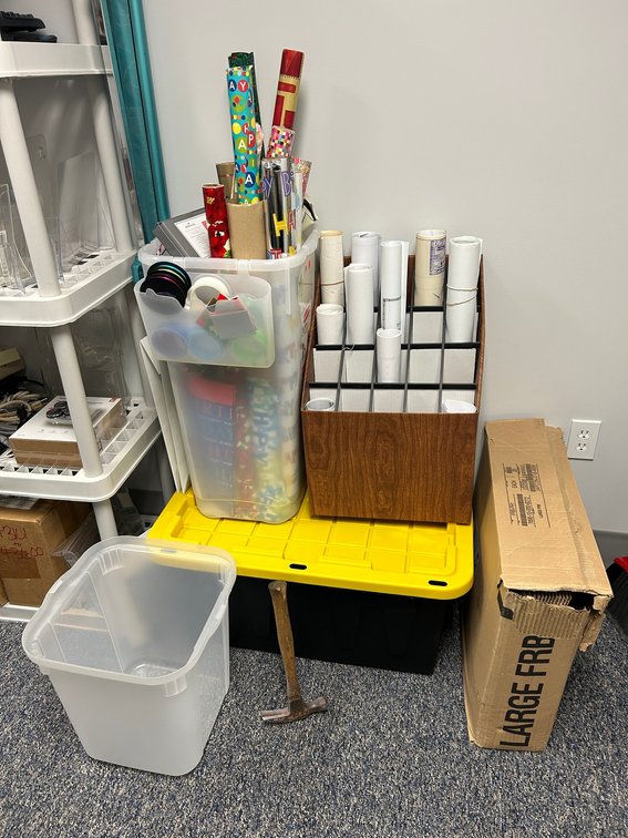Christmas items, blueprints, storage tub, hammer, etc.