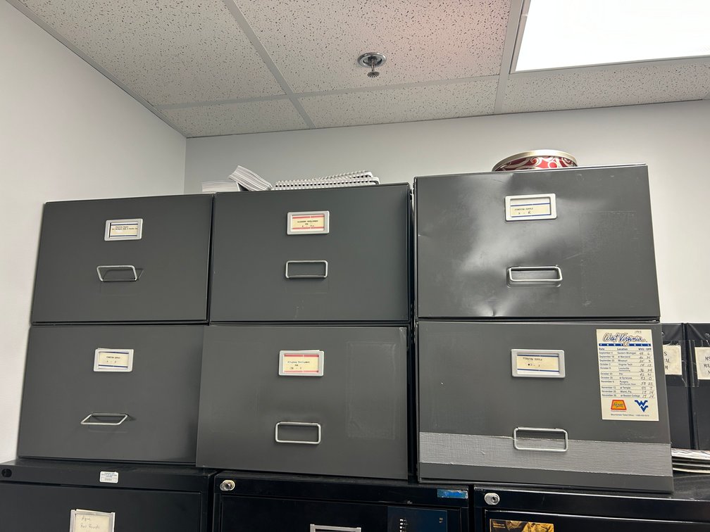 Six metal and cardboard file drawers