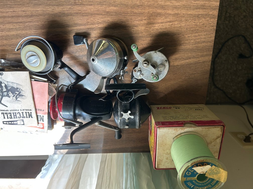 4 Fishing Reels, Box, and Fishing Line
