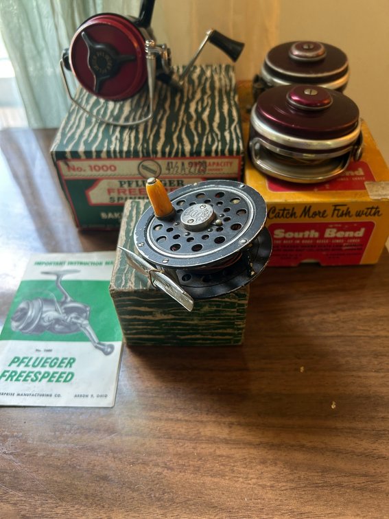 4 Fishing Reels with Boxes