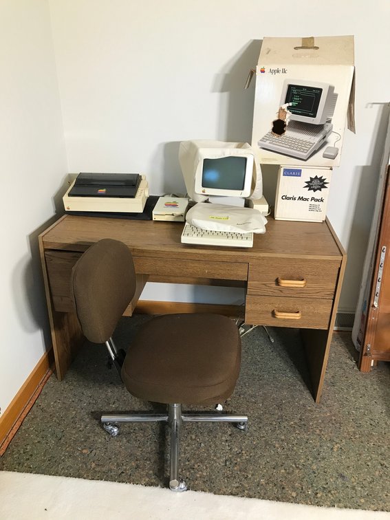 Vintage Apple computer items, desk and chair