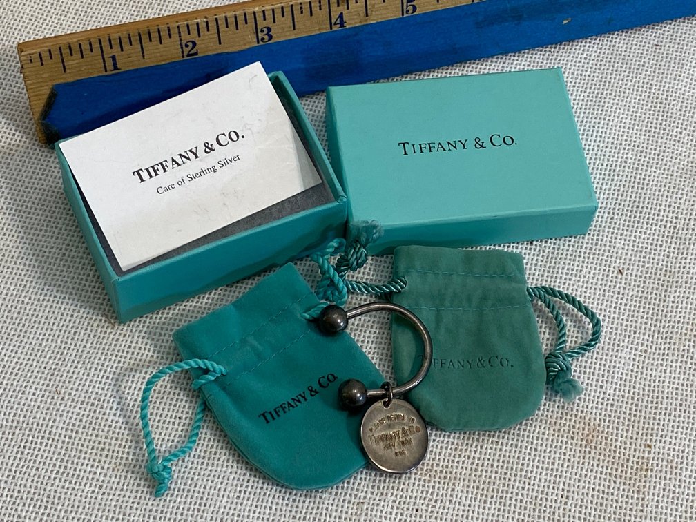 Tiffany and Company key ring marked 925 with original bag and box