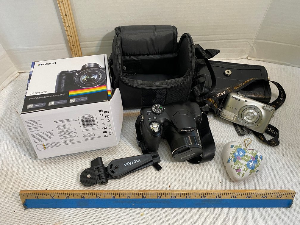 Polaroid model IE7276W digital camera with case and original box, Nikon camera
