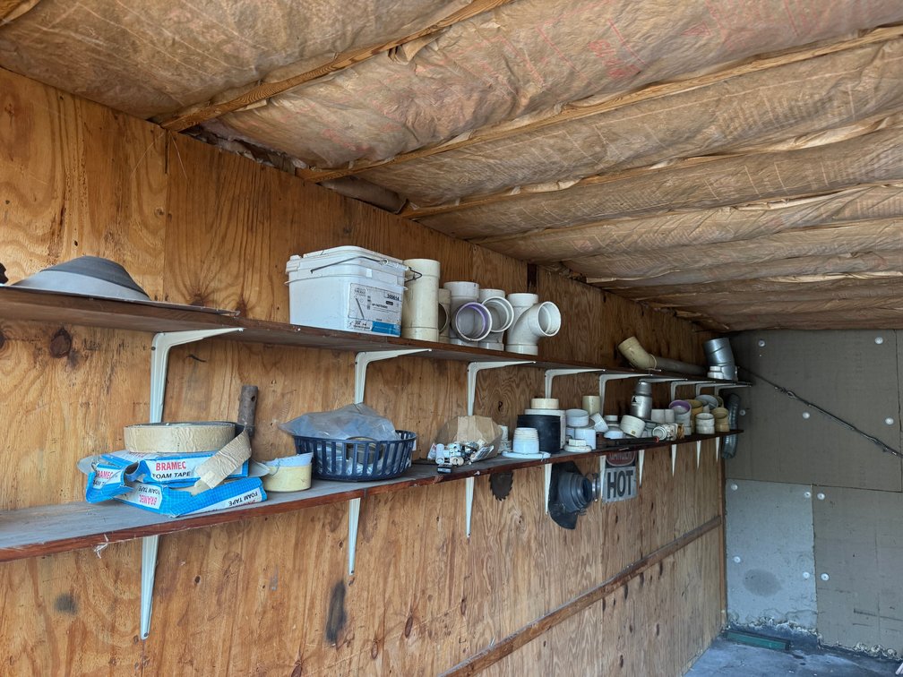 Assorted PVC pipe fittings, vent / duct fittings, clamps, and plumbing-related