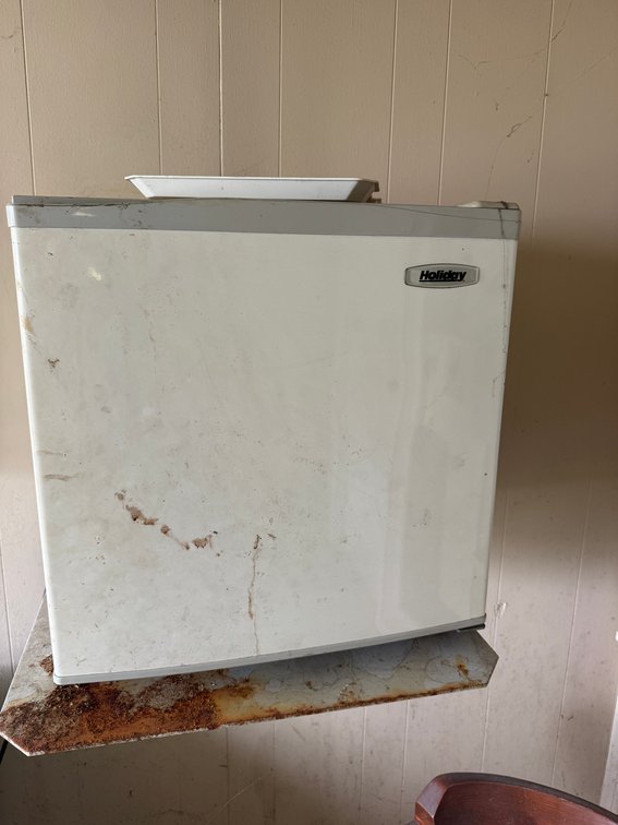 Holiday compact refrigerator with white exterior.