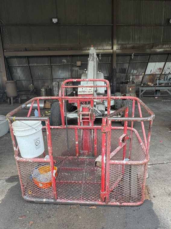 Case industrial rough-terrain lift/boom machine with elevated boom assembly and heavy-duty tires.