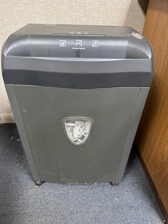 24-sheet cross-cut paper shredder with pull-out waste bin and casters.