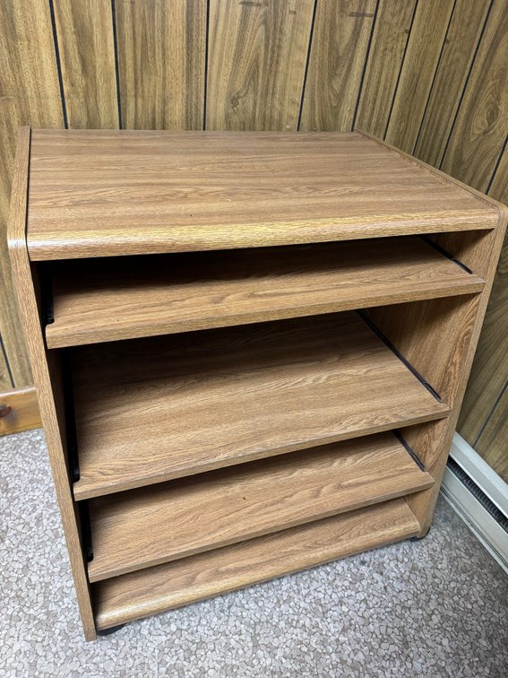 Wood-grain multi-shelf office stand or printer cart with open adjustable shelving.