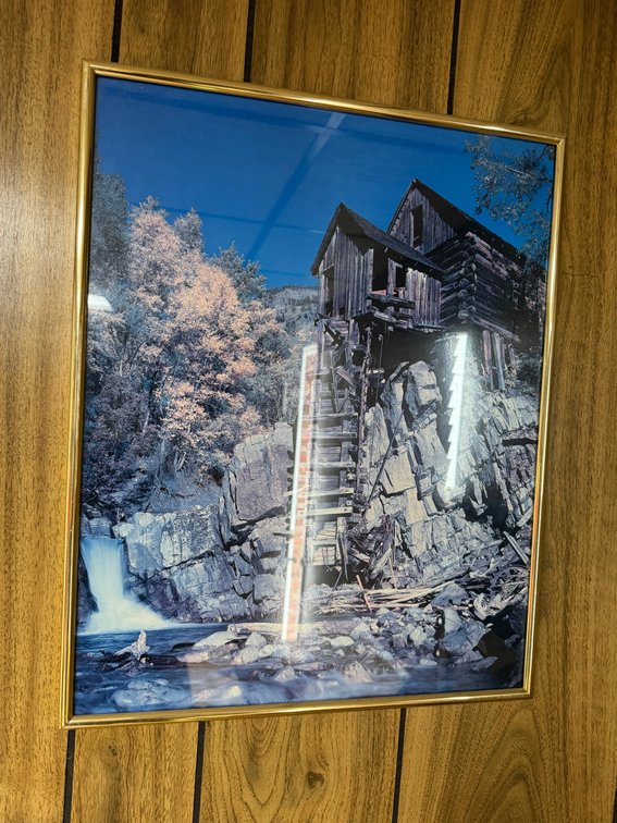 Framed scenic wall print featuring a rustic watermill and waterfall landscape.