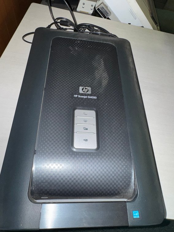 HP Scanjet G4050 flatbed photo/document scanner with front control buttons and USB/power cables.