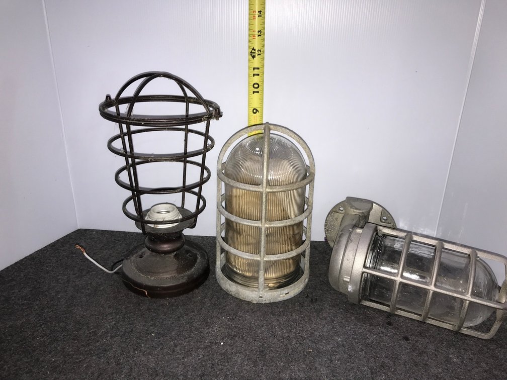 Industrial caged light fixtures