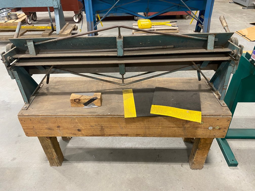 4' Enco break with custom stand-56" x 47" x 22"