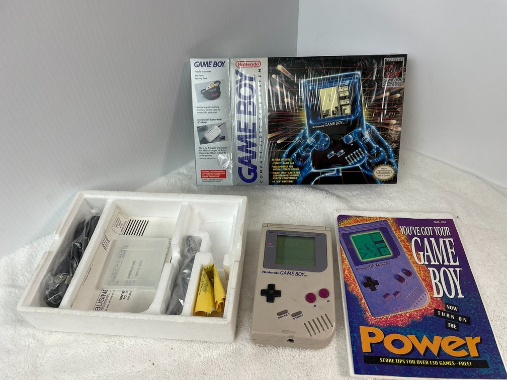 Gameboy compact video game handheld system-in box with all packaging-cellophane still on box but open on one side-unit functions
