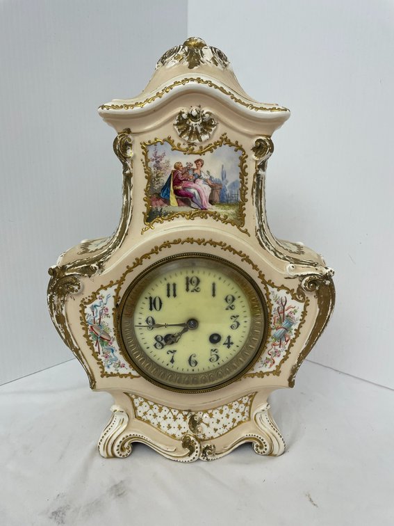 Vintage decorated porcelain clock with gold trim-with key