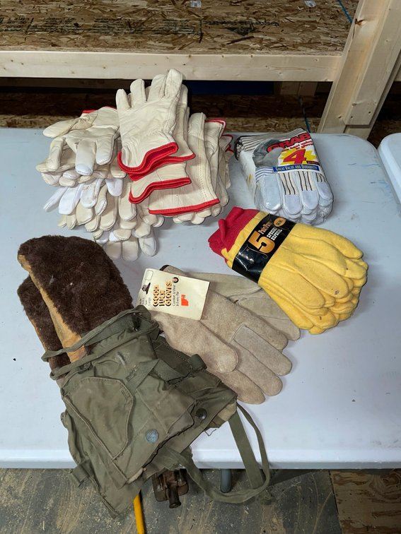 Selection of work gloves, some leather and insulated-some not, military pair of mittens-police gloves